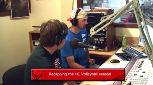 Kirk hosting the year-in-review episode of "The Round Up" alongside Josh Tietjen. The rest of the cast is in the far room.